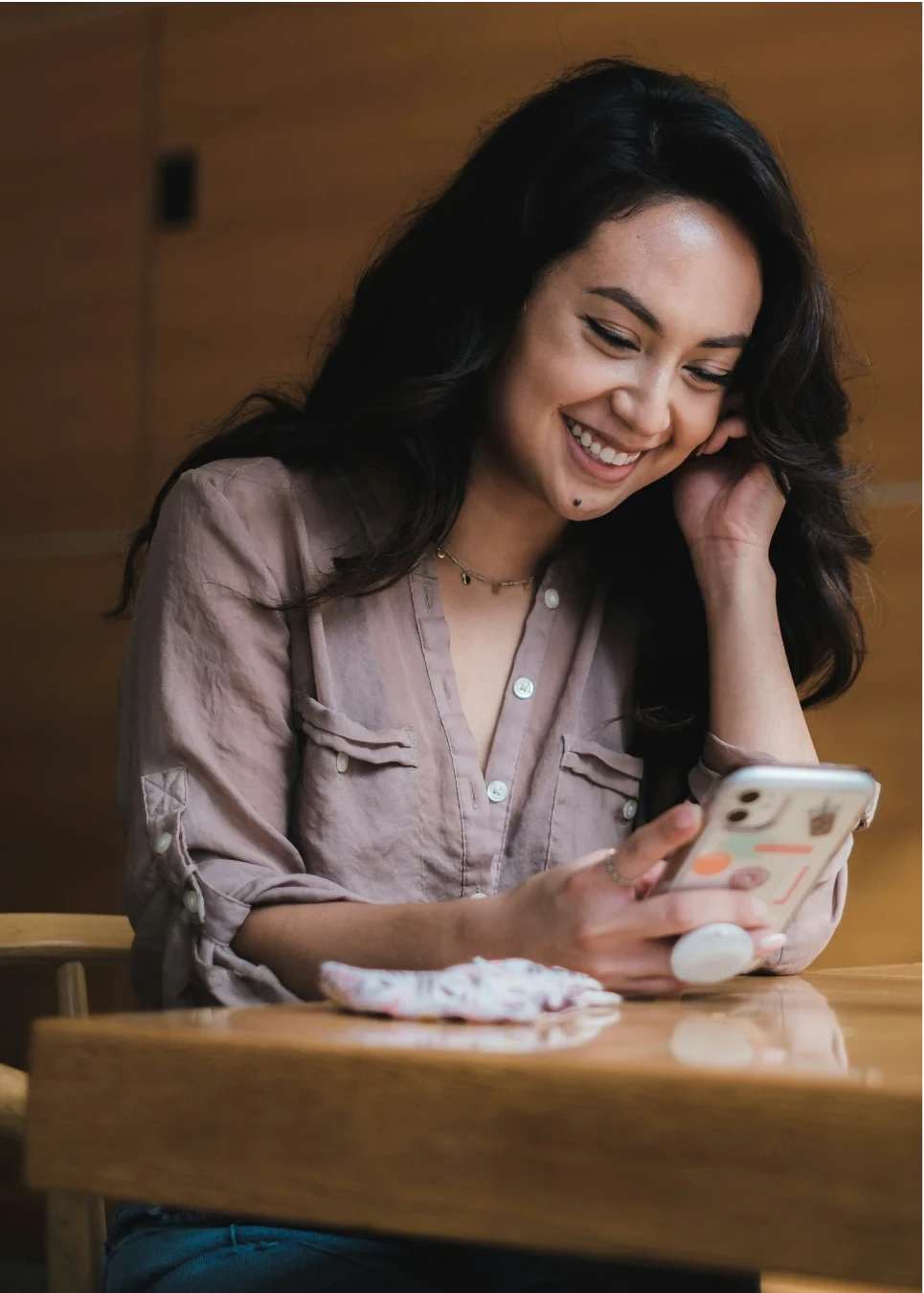 A woman smiling during a call with her Navi navigator